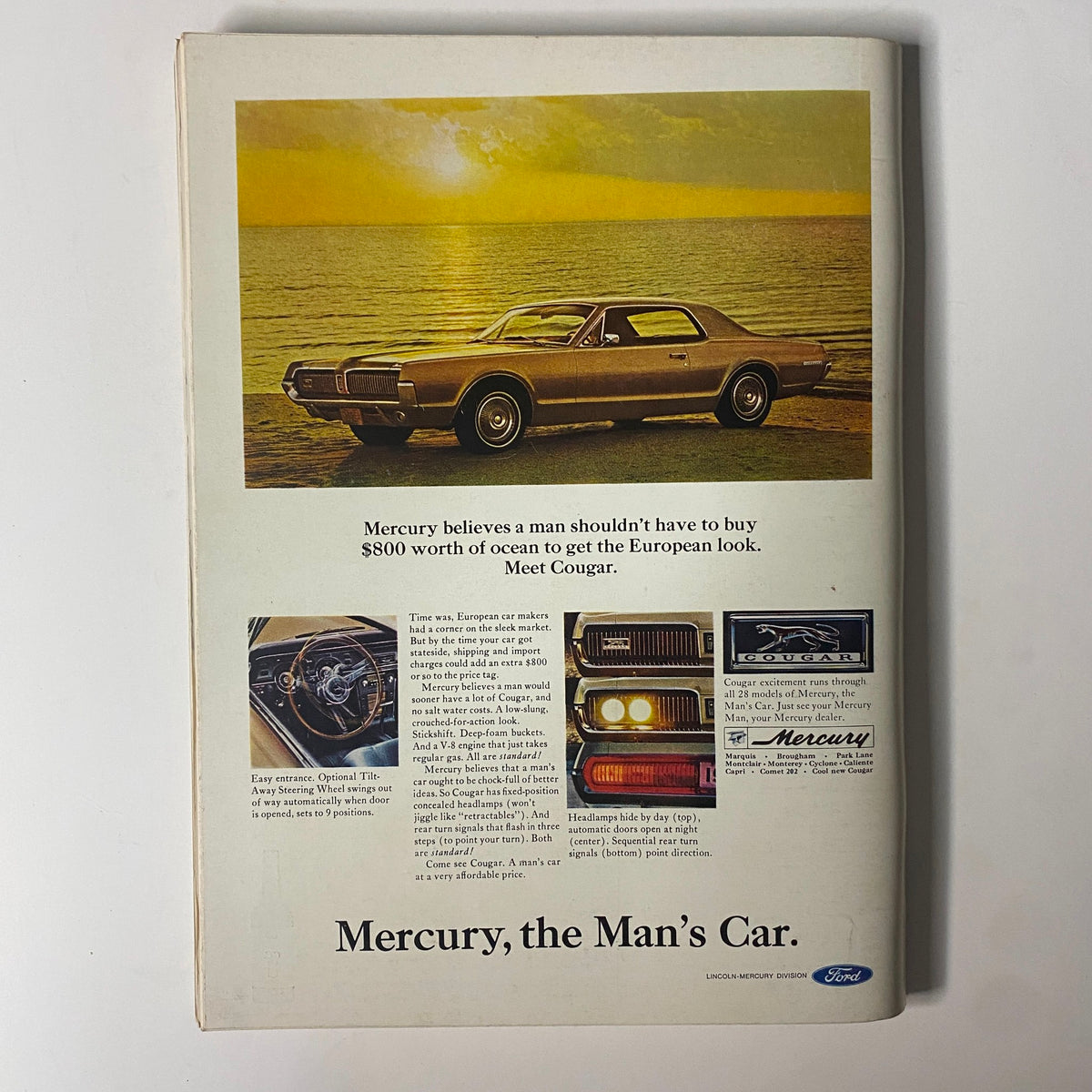 Back cover advertisement from Playboy Magazine December 1966 promoting the Mercury Cougar car, set against a scenic sunset background.