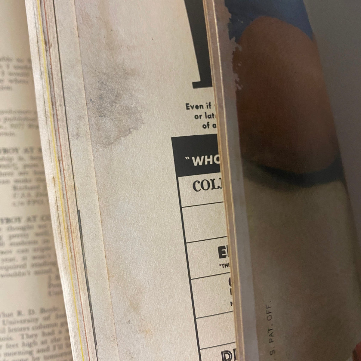 Close-up view of the pages in Playboy Magazine July 1955 showing some water damage, featuring the title 'Playboy Magazine July 1955 Playmate Janet Pilgrim'.