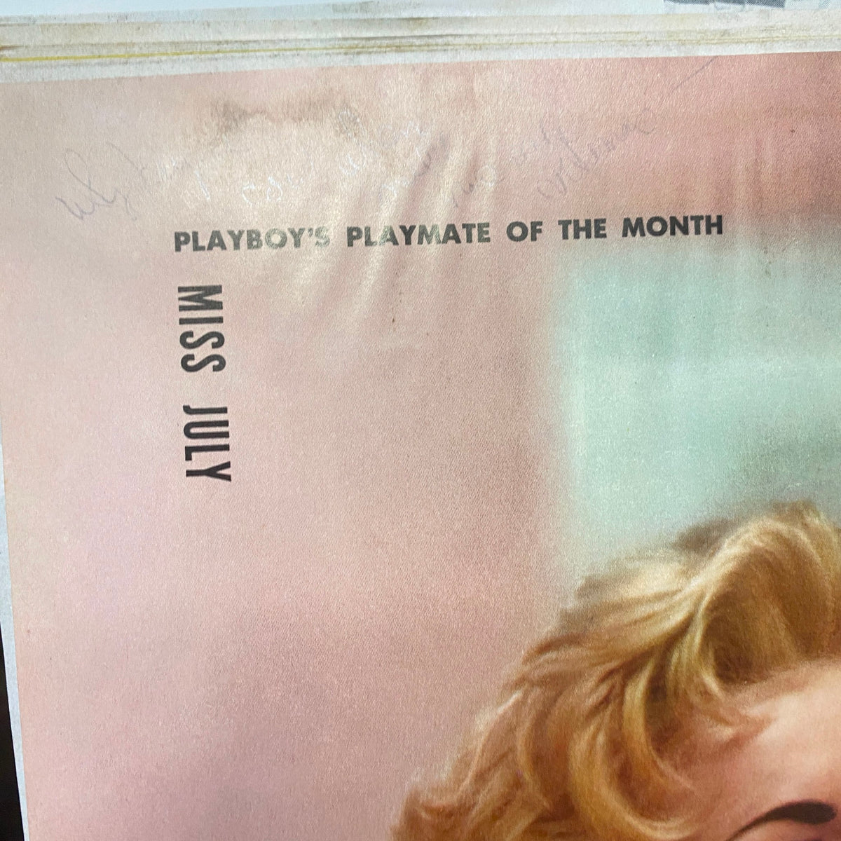 The page showcasing 'Miss July' as the Playmate of the Month from Playboy Magazine July 1955, with a vintage photograph of Janet Pilgrim.