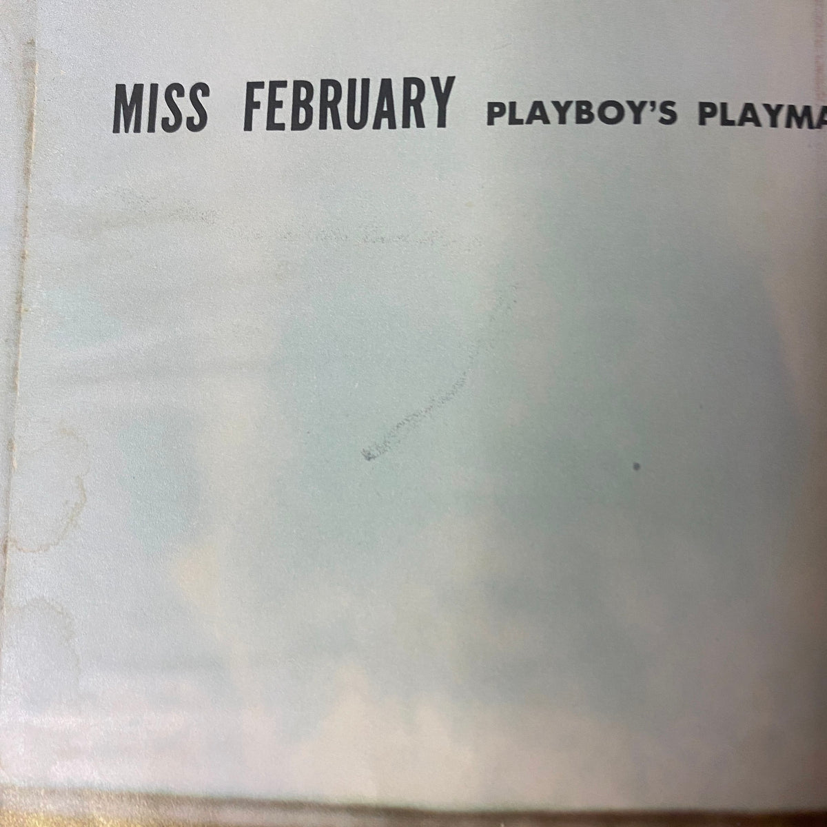 Page from Playboy Magazine February 1958 highlighting 'Miss February', the magazine's Playmate of the Month, featuring elegant typography.