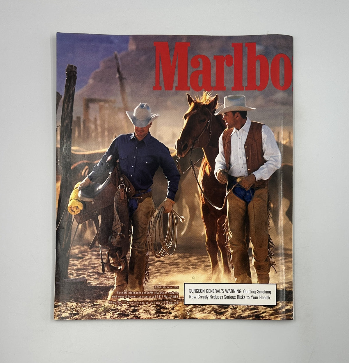 Cover art of Marlboro advertisement featuring two cowboys in a Western landscape, emphasizing the brand's theme of ruggedness.