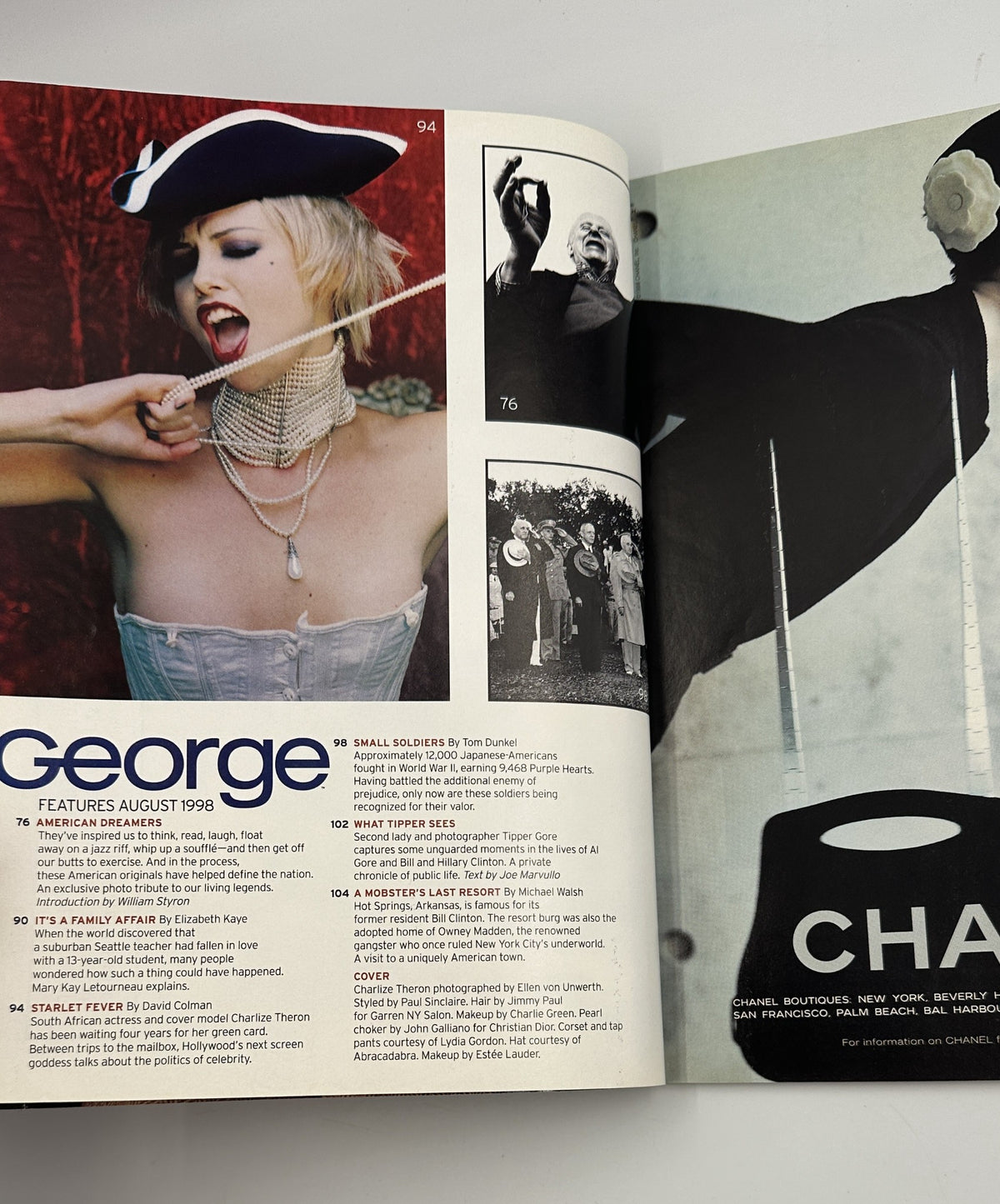 An interior page of George Magazine August 1998 showcasing features including Charlize Theron, a photo spread, and a table of contents highlighting significant articles.