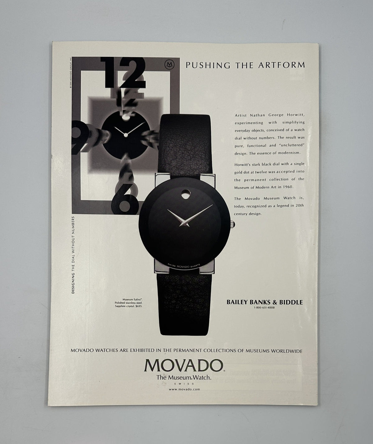 Movado advertisement showcasing the minimalist design of a wristwatch, placed under the title 'Pushing the Artform.' This advertisement is featured in George Magazine June 1999.
