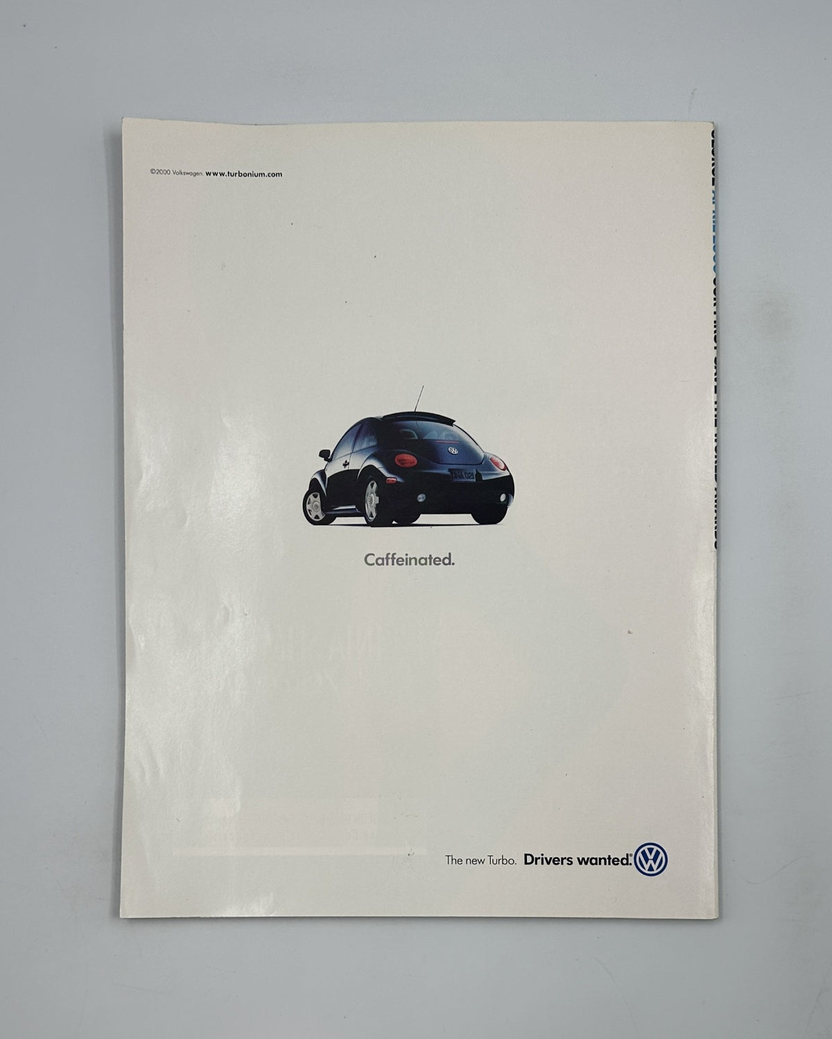 Back cover of the April 2000 issue of George Magazine, displaying an advertisement for a Volkswagen car with a minimalist design and the tagline 'Caffeinated'.
