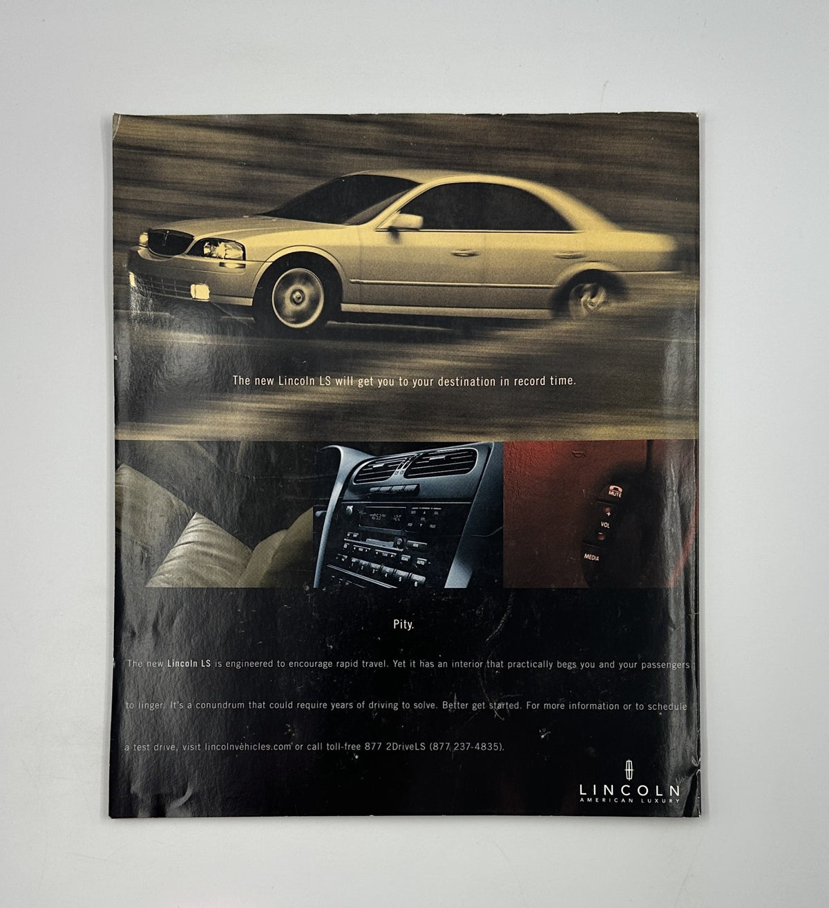 Back cover of George Magazine October 2000 advertising the Lincoln LS, showcasing its design for travel comfort and practicality.