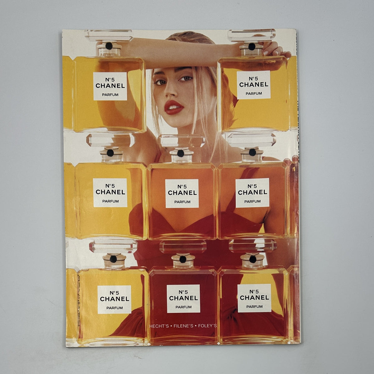 Promotional image featuring Chanel No. 5 perfume bottles, enhancing the luxurious aesthetic associated with George Magazine January 1999.