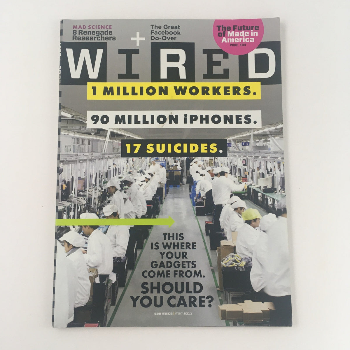 Wired Magazine March 2011 featuring the title '1 Million Workers, 90 Million iPhones'. The cover depicts a factory scene with workers in protective gear assembling gadgets, highlighting topics such as labor and technology.