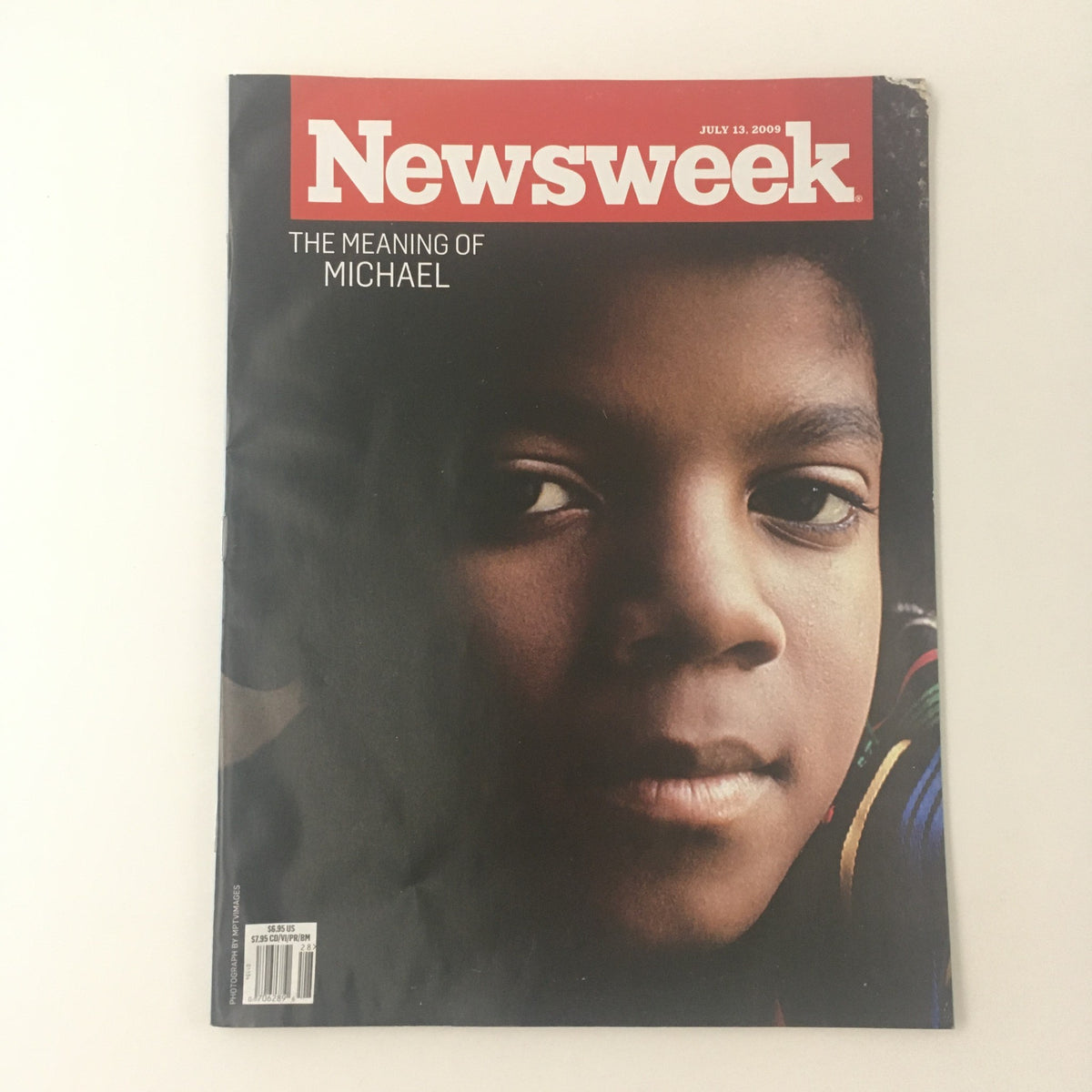 Cover of Newsweek Magazine July 13, 2009, featuring The Meaning of Michael Jackson, showcasing a close-up of a young boy's face, reflecting the essence of the issue's exploration of Michael Jackson's legacy in music and culture.