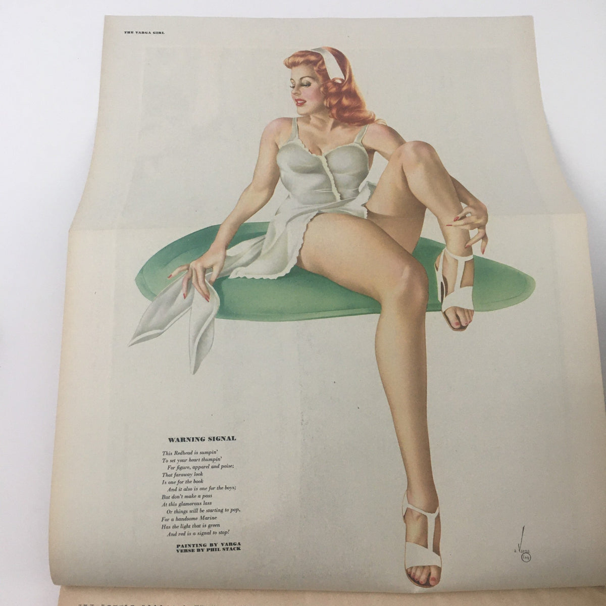 Interior page of Esquire Magazine June 1945 showcasing a Vargas girl illustration, presenting vintage pin-up art and poetic text 'Warning Signal'.