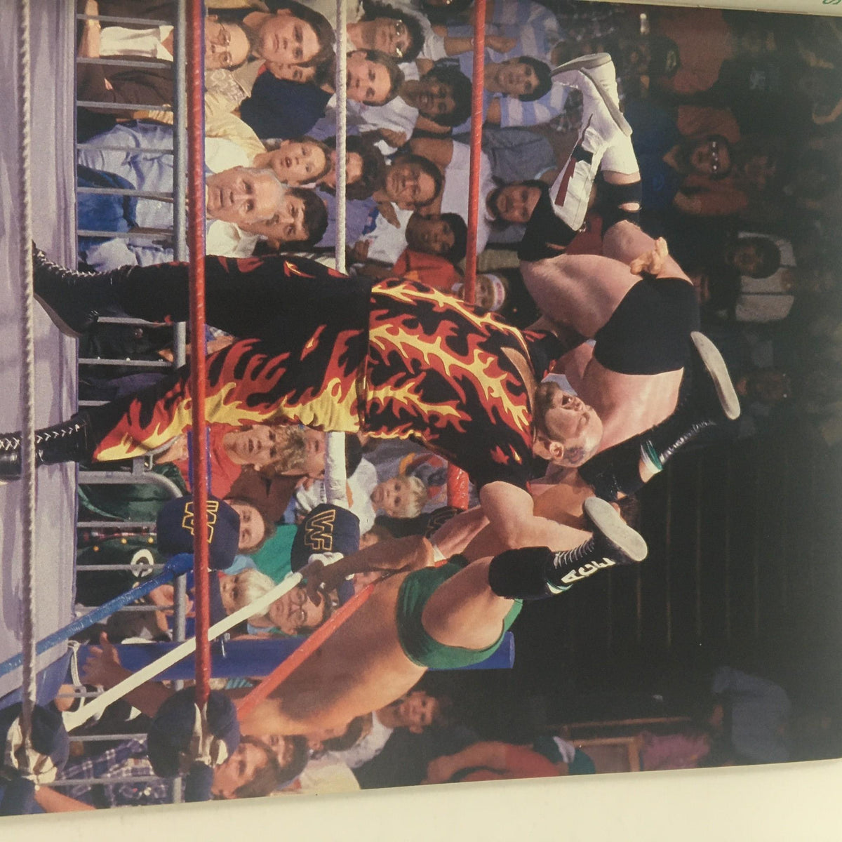 Action shot from WWF Magazine January 1988, capturing an intense wrestling moment with fans engaging in the background, depicting the excitement of professional wrestling.