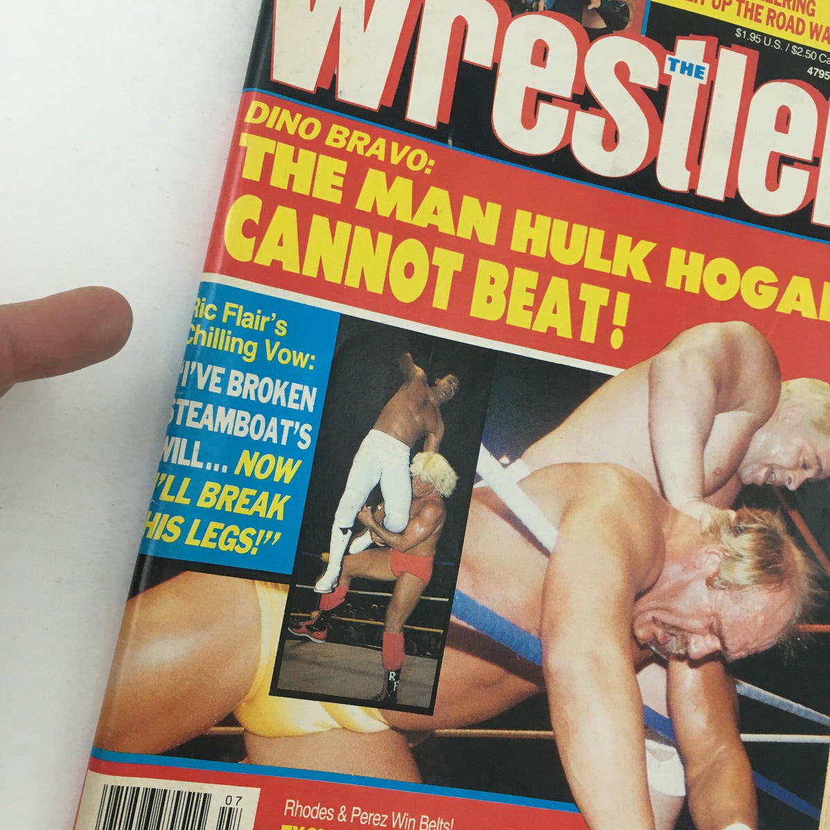 Close-up view of The Wrestler Magazine July 1989 cover highlighting Hulk Hogan, Ric Flair, and Dino Bravo with an eye-catching headline. The magazine is a collector's item showcasing iconic wrestlers from the 1980s.