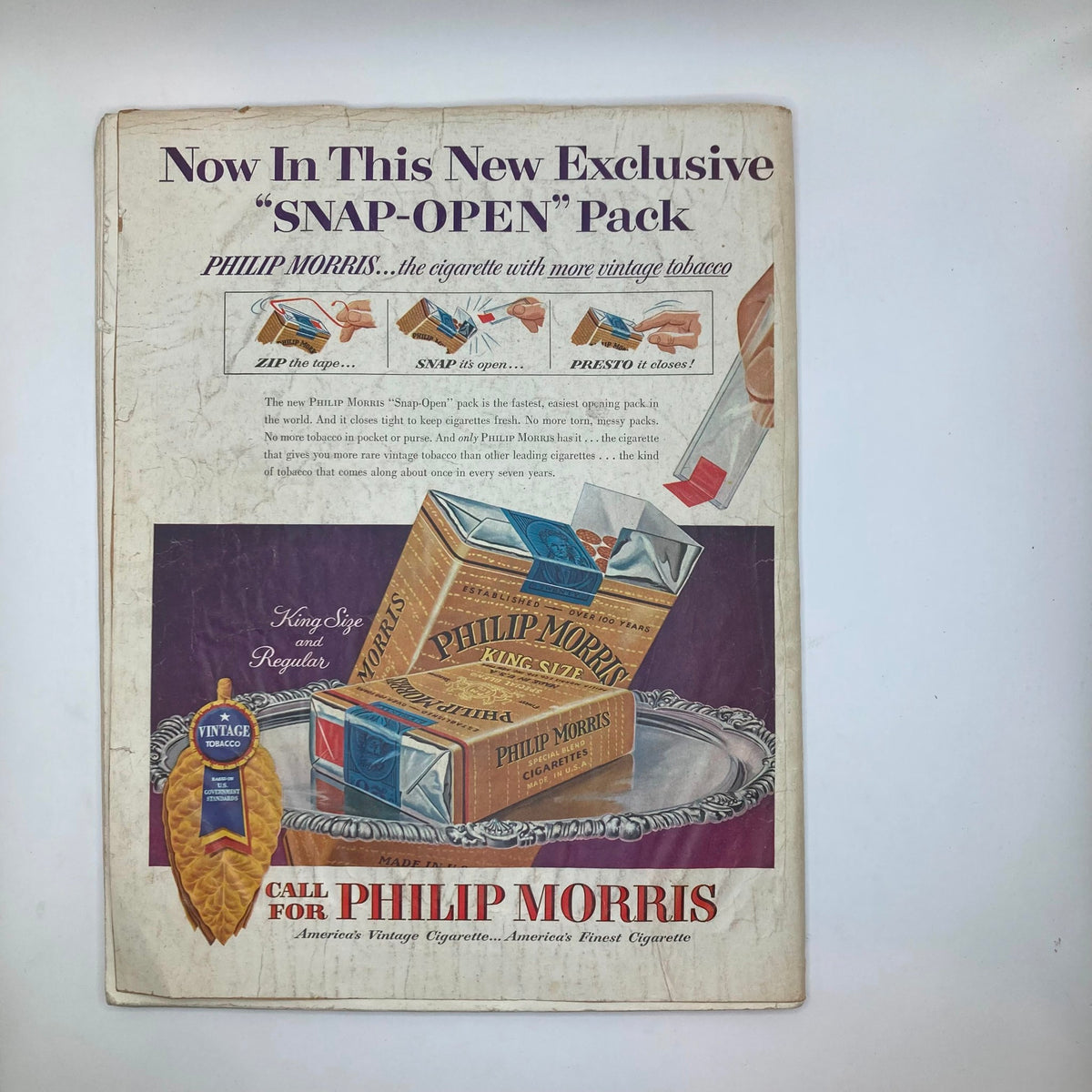 Another interior page of the Saturday Evening Post Magazine May 8, 1954 with promotional content for the Philip Morris 'Snap-Open' cigarette pack.