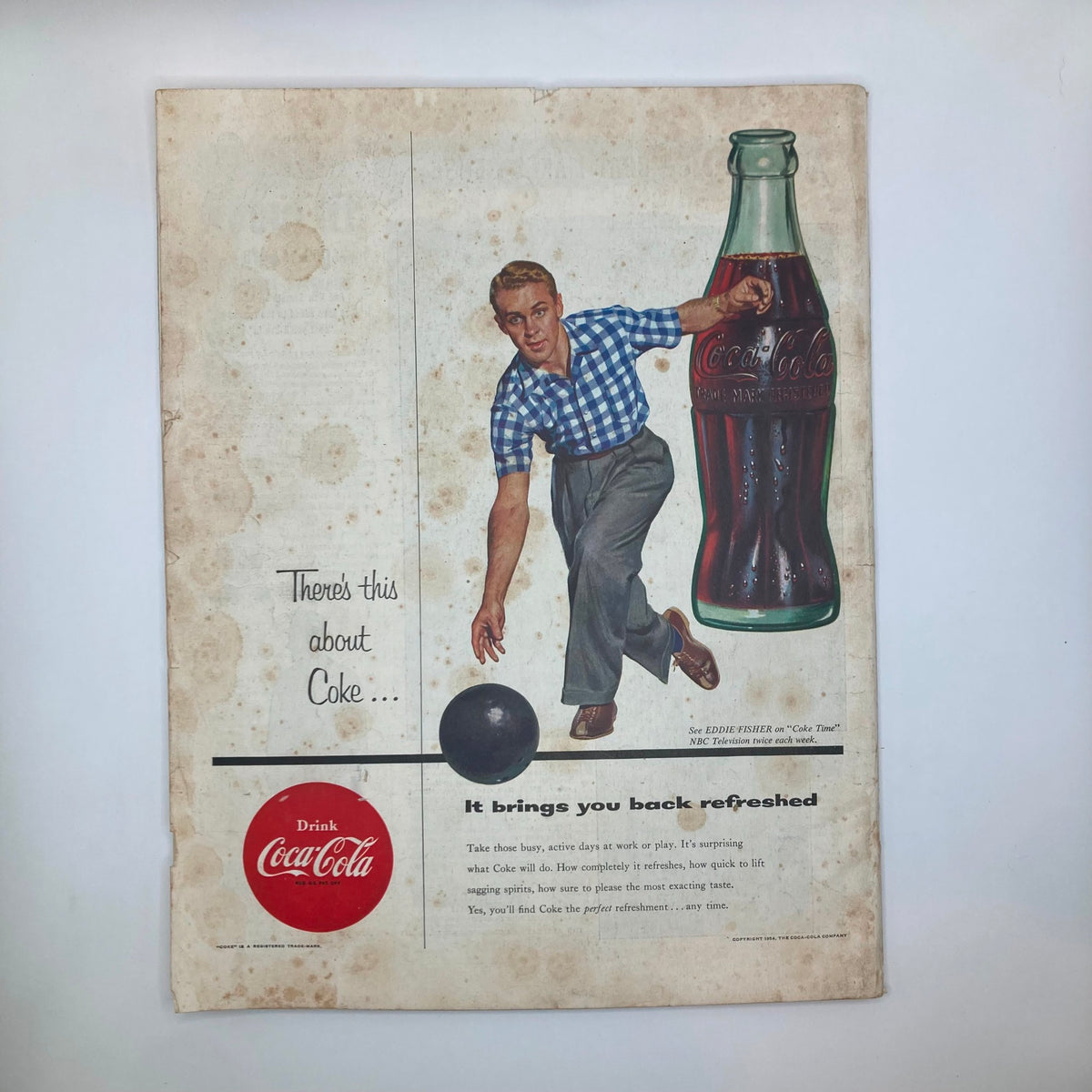Vintage advertisement for Coca-Cola in the Saturday Evening Post Magazine from March 20, 1954, showing a young man bowling with a Coke bottle.