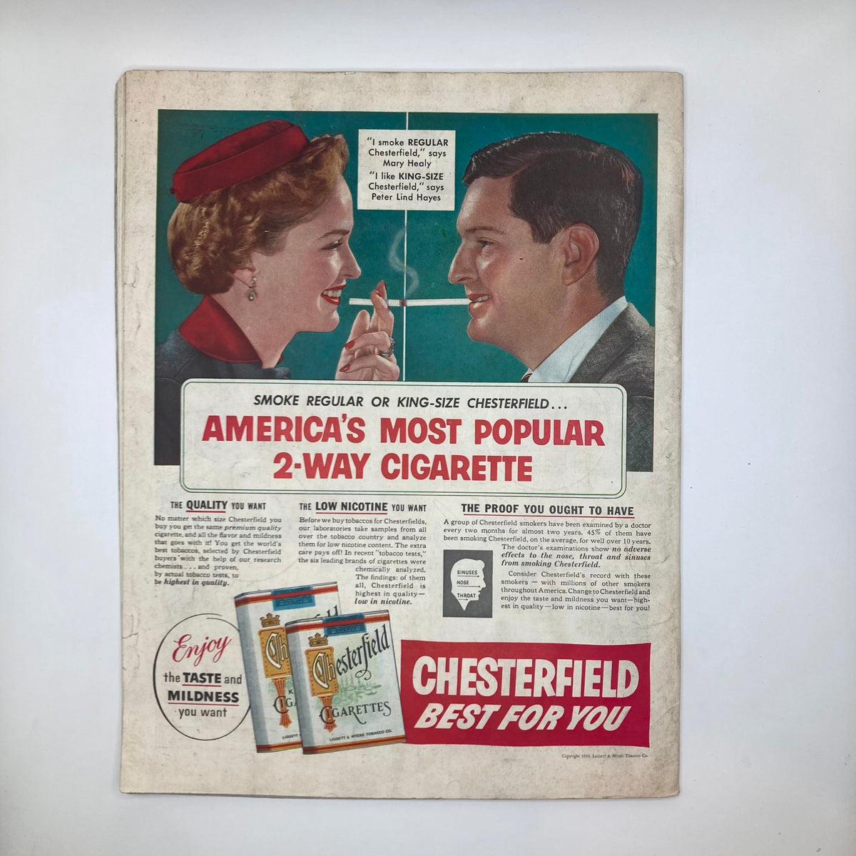 Back cover of the Saturday Evening Post Magazine April 3, 1954 showcasing an advertisement for Chesterfield cigarettes, featuring two people engaging with the product.