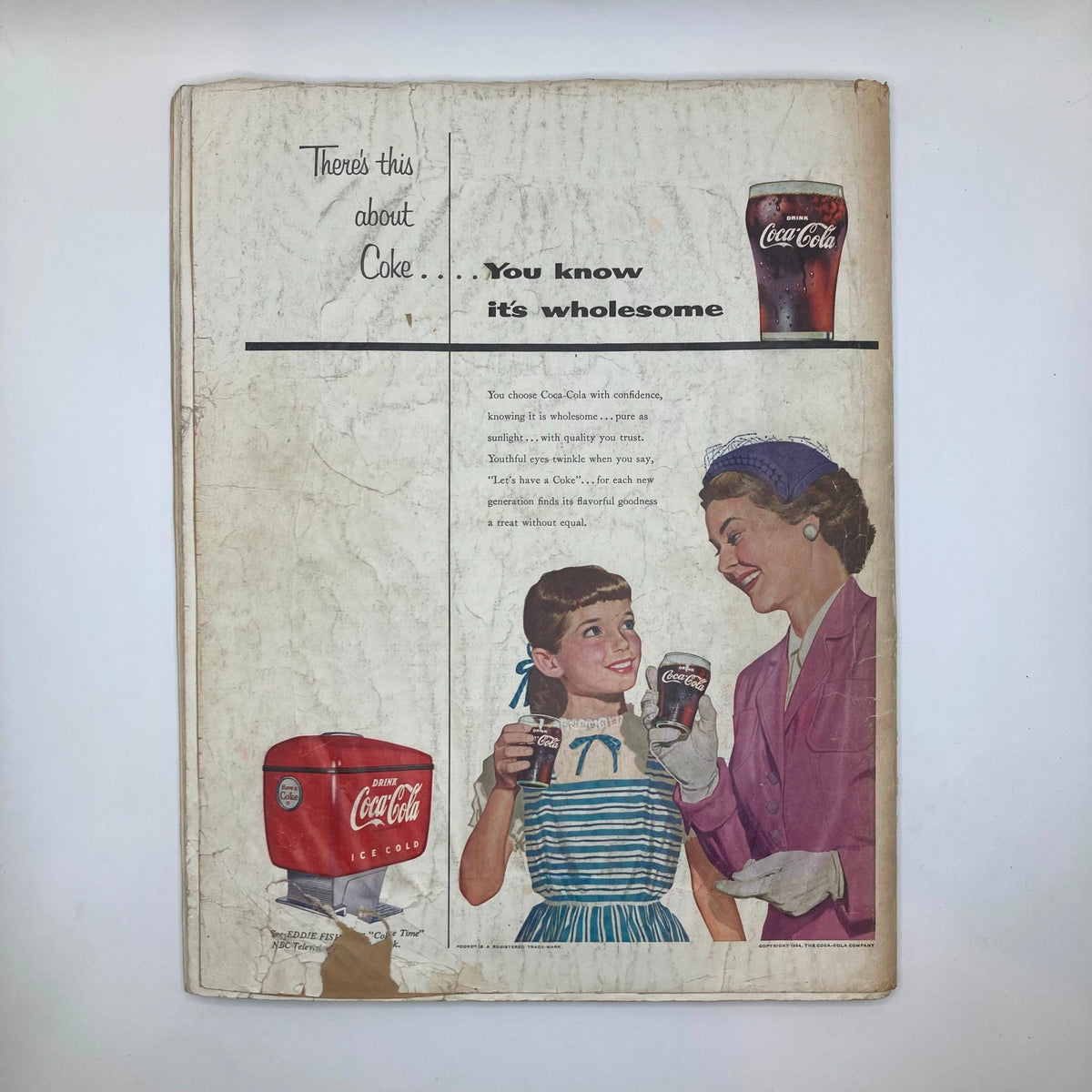 Back cover advertisement from the Saturday Evening Post Magazine, May 15, 1954, featuring a Coca-Cola advertisement with women enjoying drinks.
