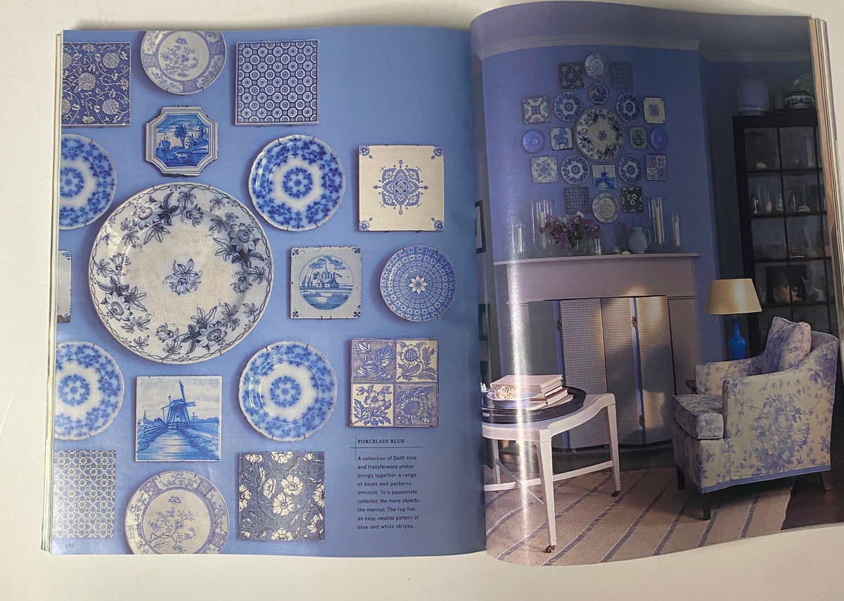 Page from Martha Stewart Living Magazine September 2000 Decorating Issue displaying decorative blue plates arranged on a wall in a stylish living room.