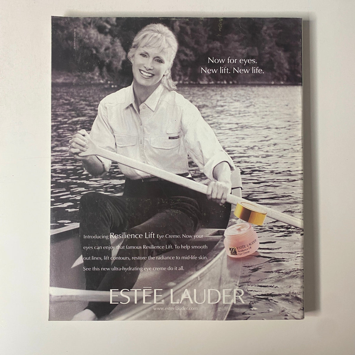 Advertisement from Martha Stewart Living Magazine October 2000 for Estee Lauder Resilience Lift Eye Cream, featuring a model rowing on a lake, promoting beauty and skincare.