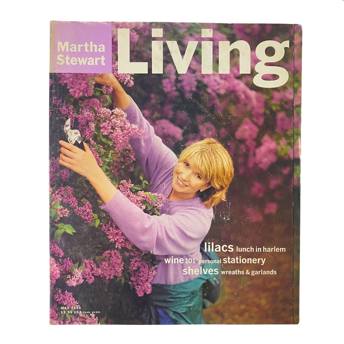 Cover of Martha Stewart Living Magazine May 1996, featuring Martha Stewart amidst blooming lilacs at Grape Hill Gardens, with lush purple flowers and gardening tools.
