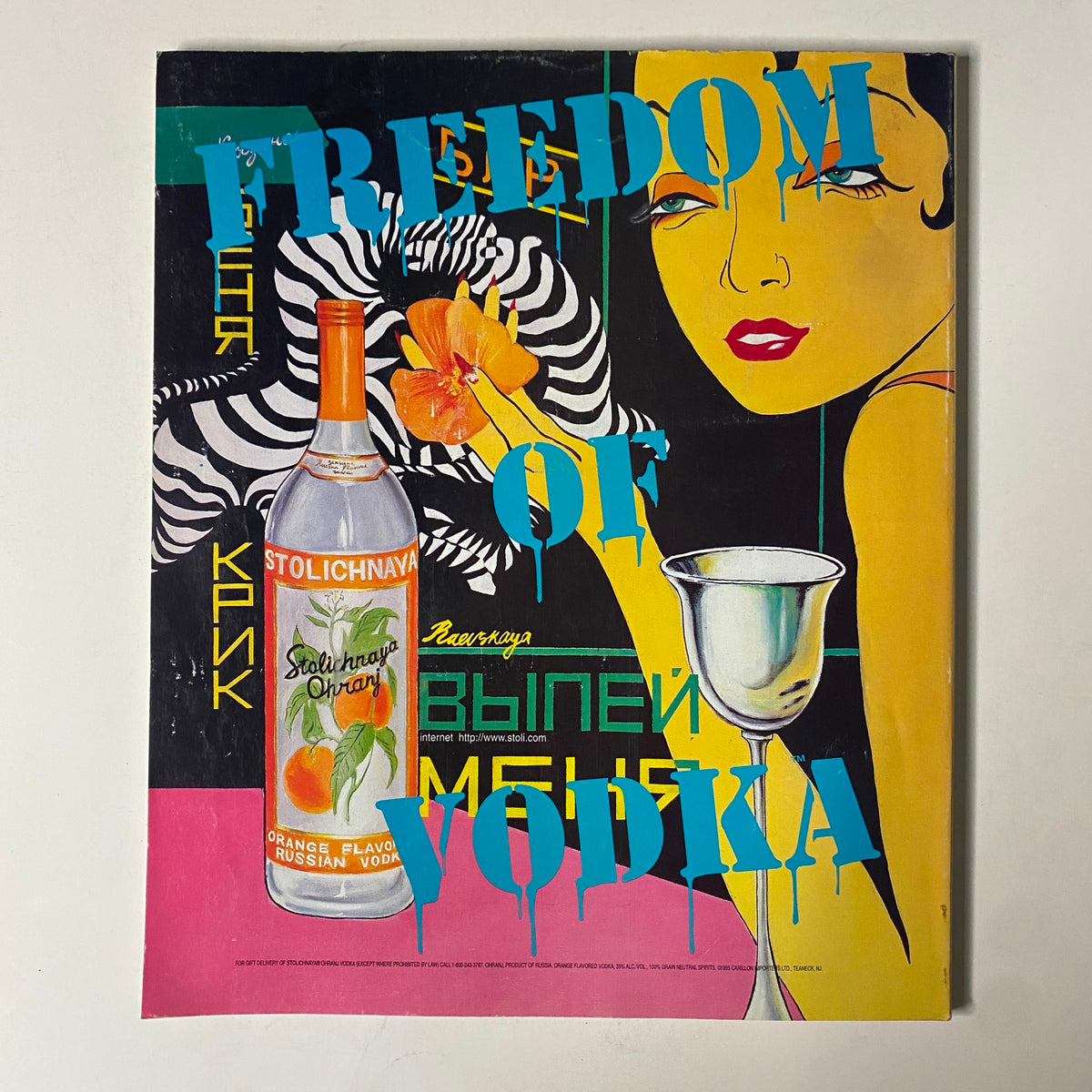 Vintage advertisement titled 'Freedom of Vodka' featuring a bold graphic design, a bottle of Stolichnaya vodka, and a striking illustration.