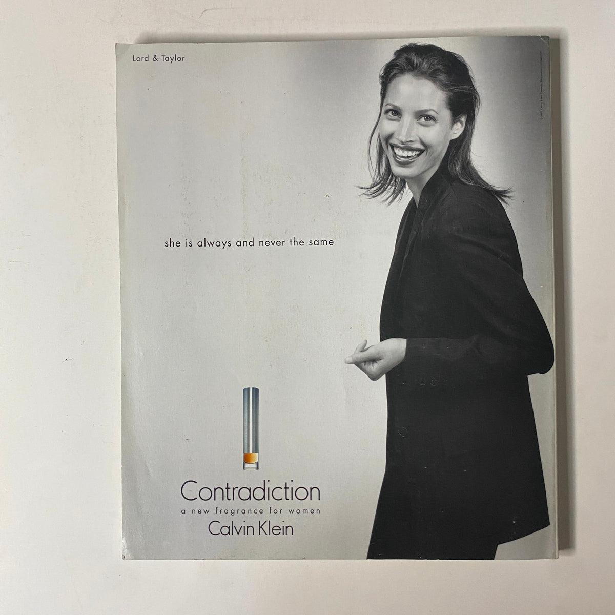 Martha Stewart Living Magazine December 1997 Beaded Ornaments No Label VG. Black and white advertisement for Calvin Klein's fragrance 'Contradiction,' featuring a smiling model promoting the luxurious perfume.