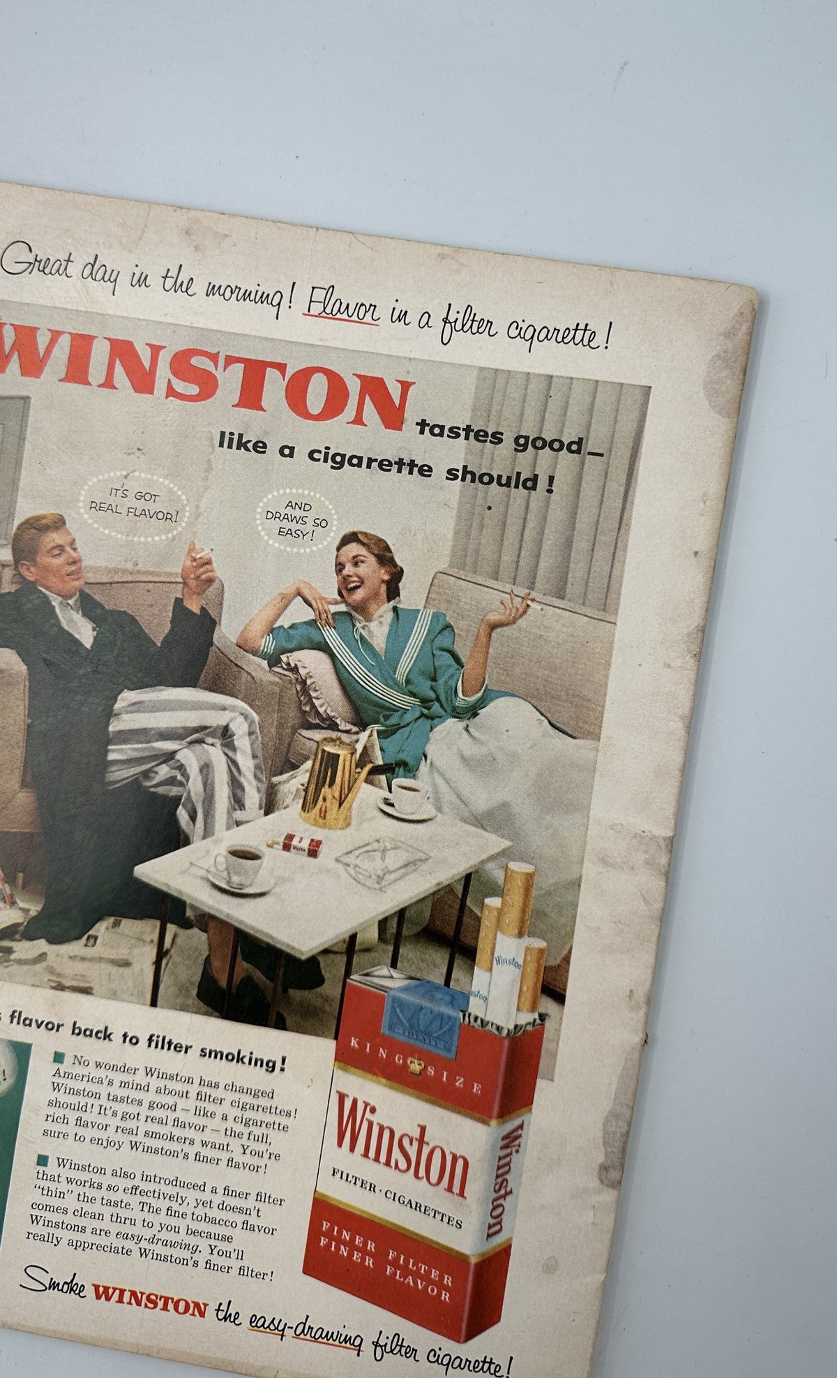 Back cover of Photoplay Magazine, May 1955 featuring an advertisement for Winston cigarettes, presenting a vintage product promotion.