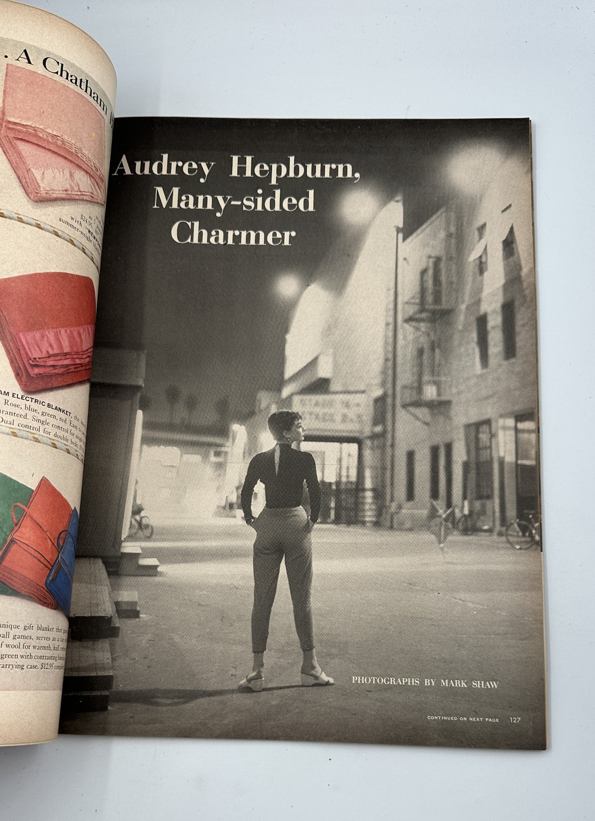 Page from Life Magazine December 7, 1953, featuring a full-page photographic essay titled 'Audrey Hepburn, Many-sided Charmer' by photographer Mark Shaw.