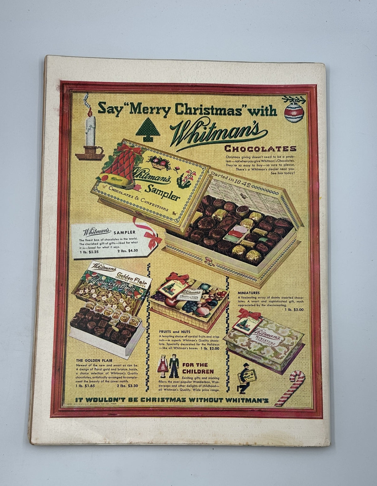 Vintage advertisement for Whitman's Chocolates featured in Life Magazine, December 7, 1953. The ad showcases various chocolate boxes and gifts, promoting the theme 'Say Merry Christmas with Whitman's Chocolates'.
