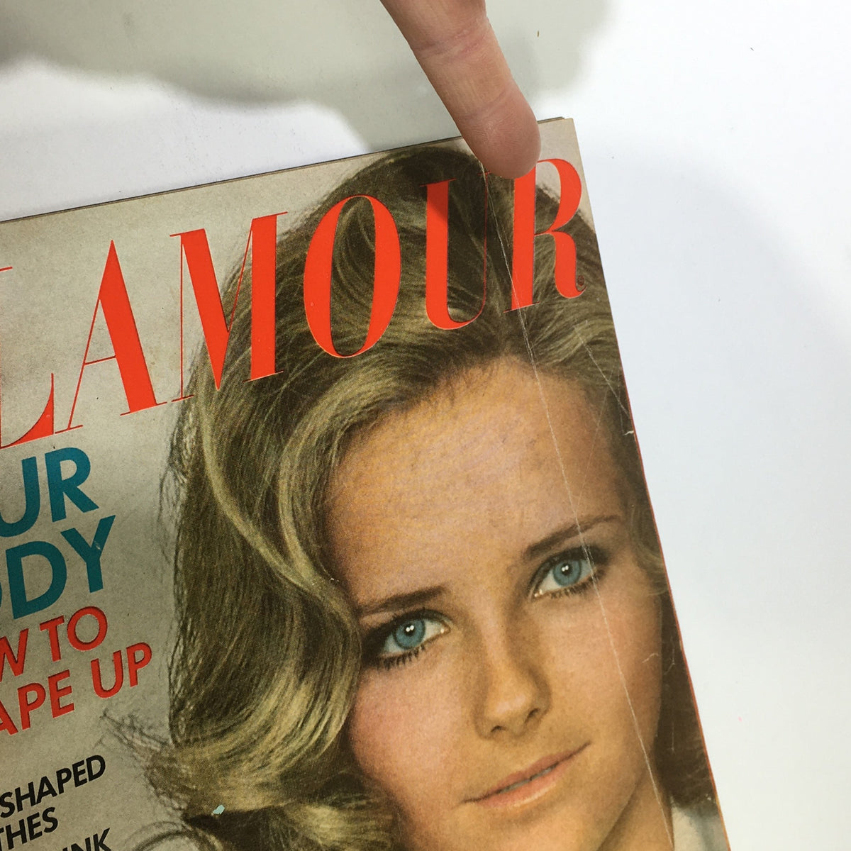 Close-up view of the Vintage Glamour Magazine April 1968 cover, highlighting Cheryl Tiegs and sections about body shaping and diet.