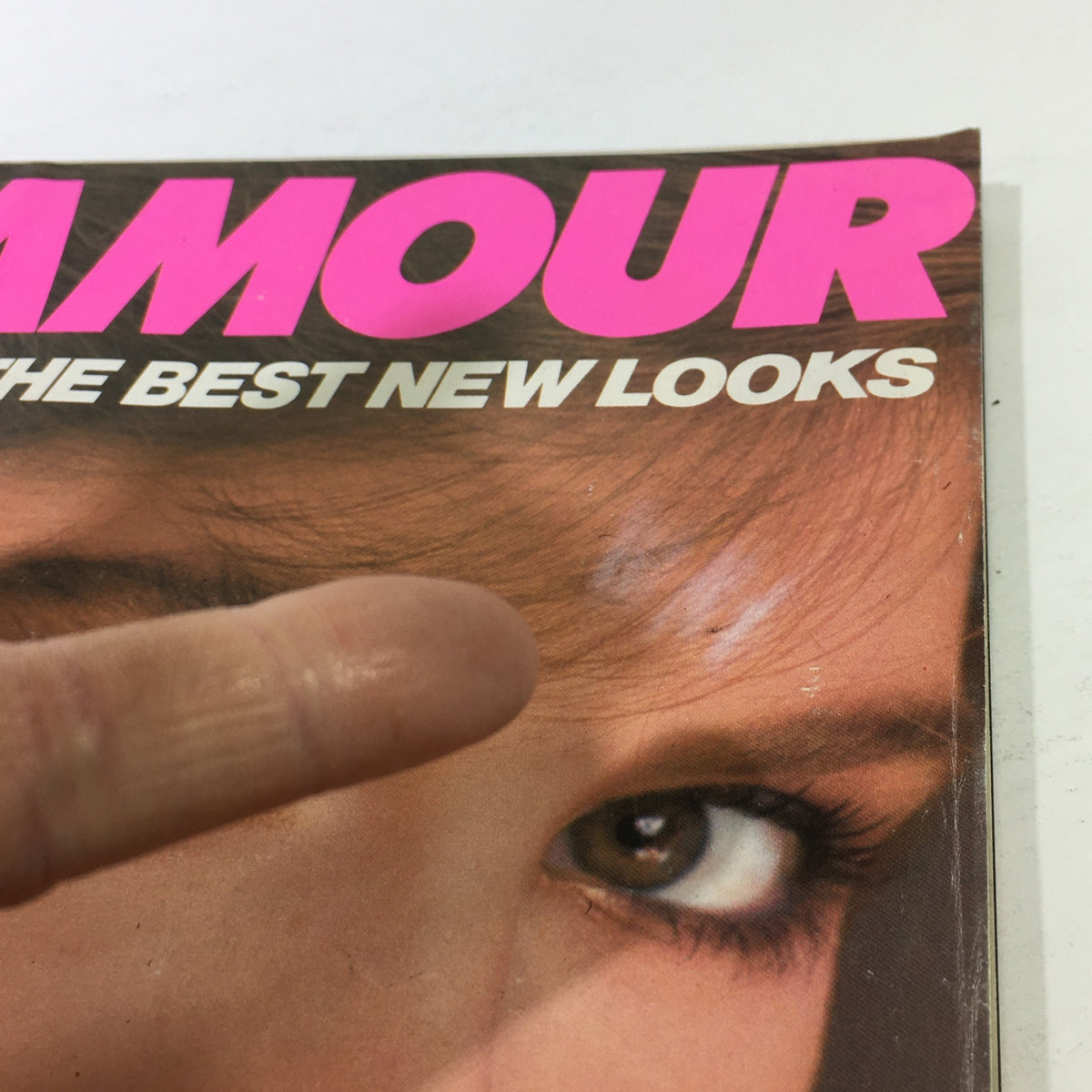 Close-up of the cover of Vintage Glamour Magazine March 1983, highlighting the title and model's expressive eyes.