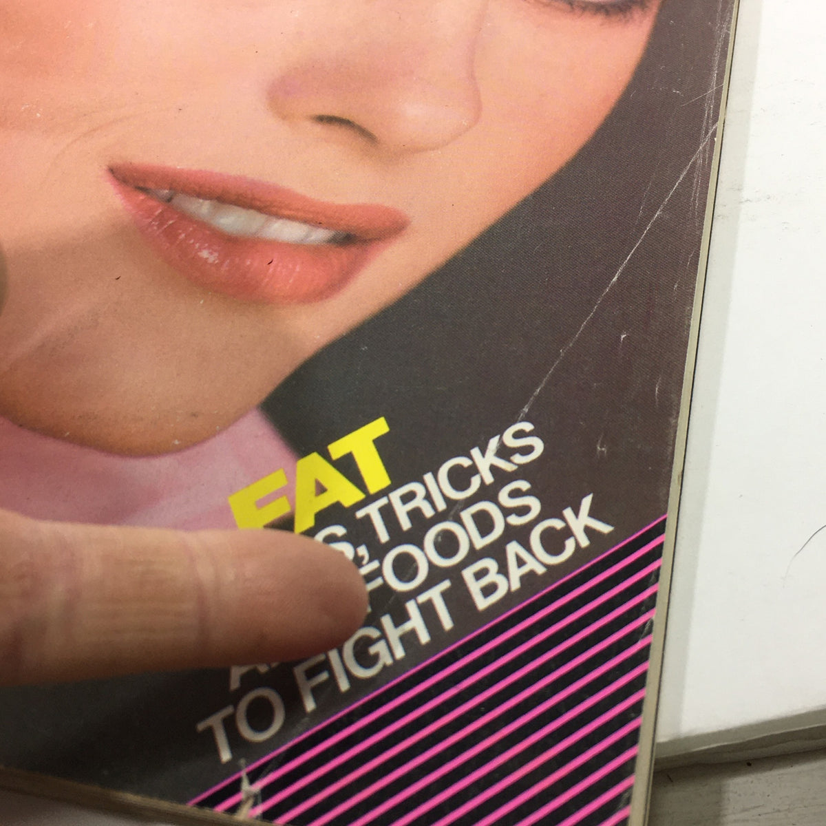 Detail of the cover of Vintage Glamour Magazine March 1983, emphasizing the tagline and the magazine's focus on beauty and wellness.