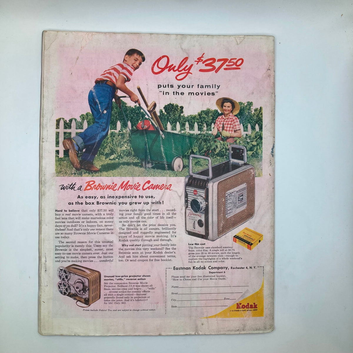 Back cover of Saturday Evening Post Magazine April 23, 1955, featuring an advertisement for a Brownie Movie Camera, inviting readers to capture family memories with this nostalgic product.