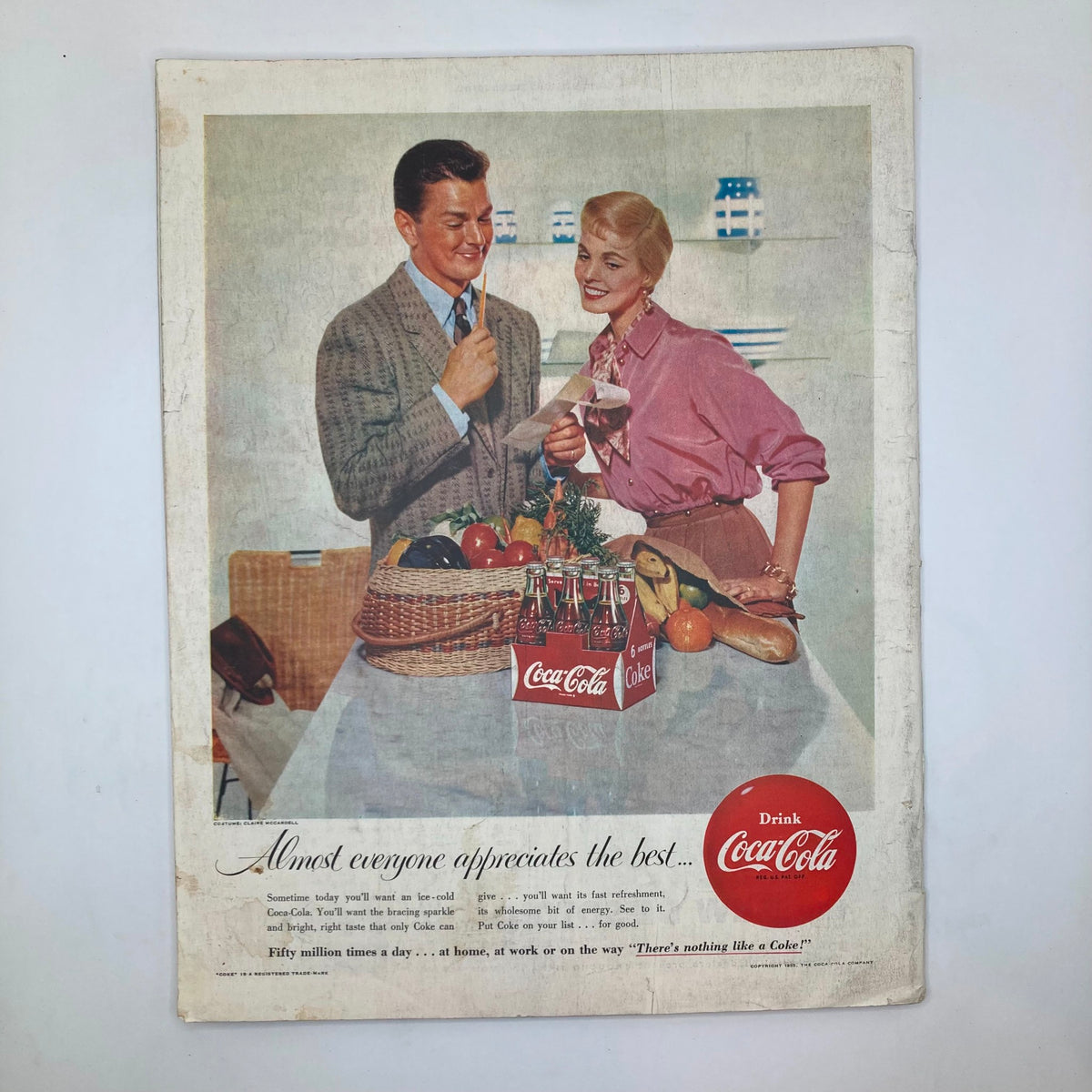 Vintage advertisement from Saturday Evening Post Magazine February 19, 1955 featuring a cheerful couple with Coca-Cola products, showcasing a nostalgic mid-20th century lifestyle.