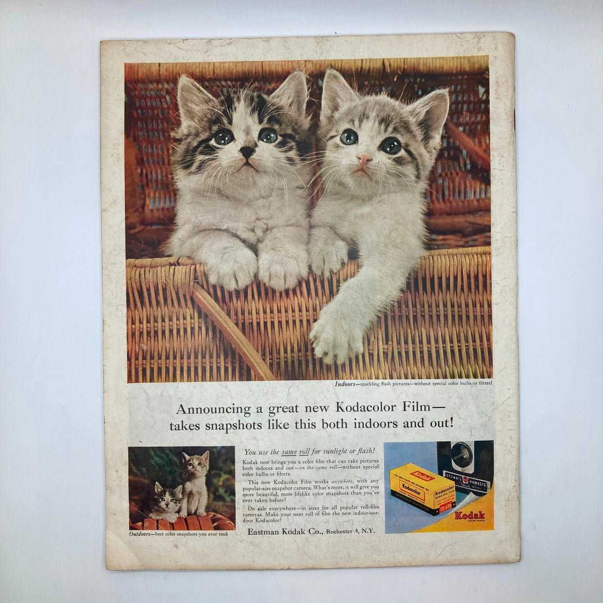 Back cover of Saturday Evening Post Magazine April 7, 1956 featuring an advertisement for Kodak film with two kittens, illustrating vintage advertising and photography.