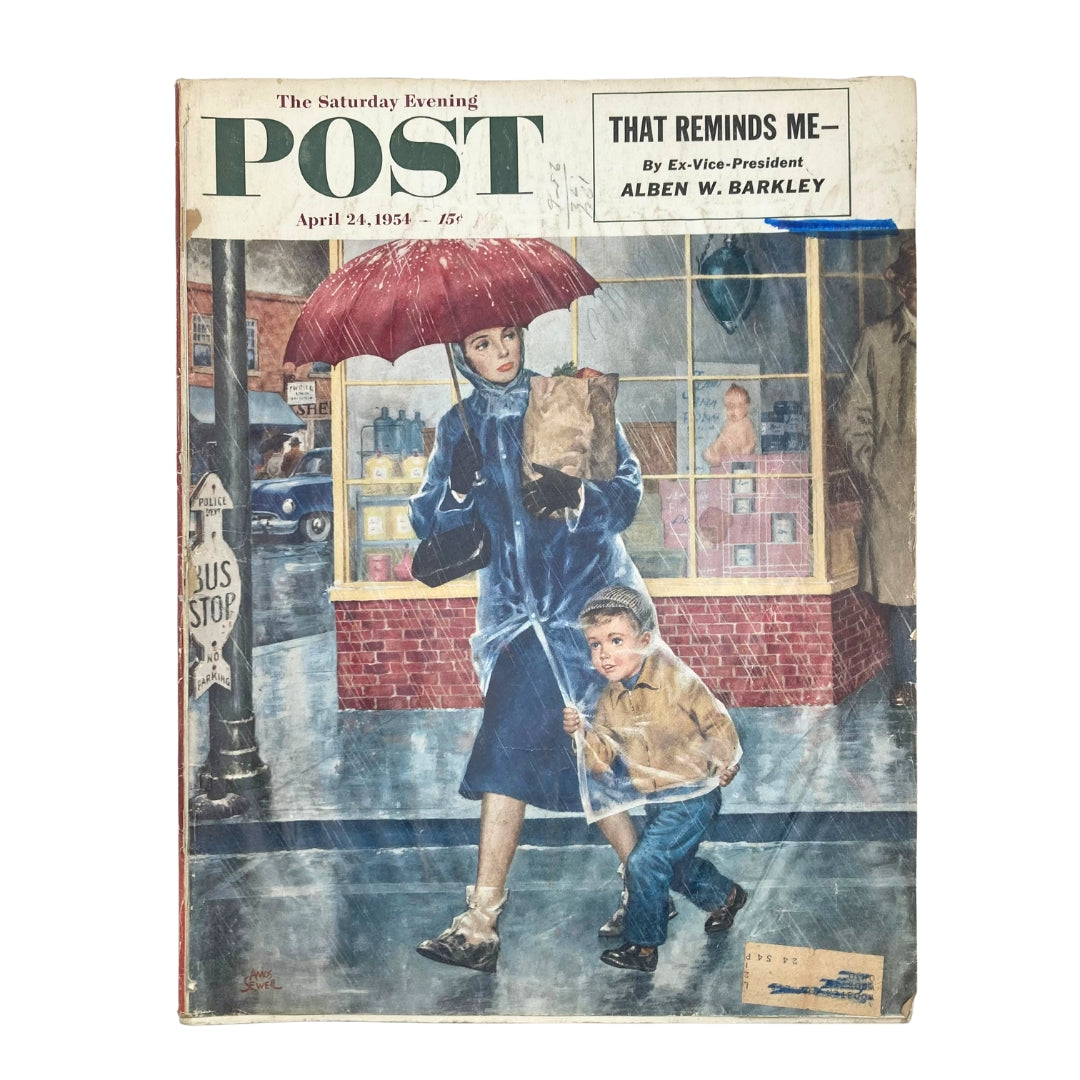 Cover of Saturday Evening Post Magazine dated April 24, 1954, featuring artwork by Amos Sewell titled 'Window Raincoats,' depicting a woman with an umbrella and a child in a raincoat walking through a rainy street.