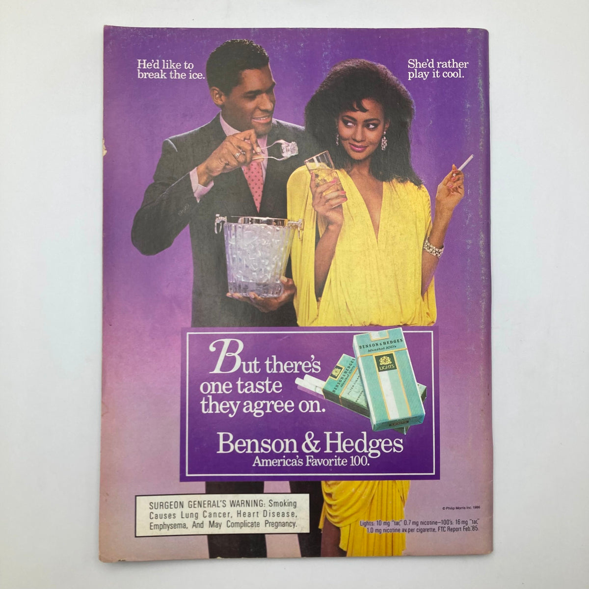 Back cover of Essence Magazine July 1986 featuring an advertisement for Benson & Hedges cigarettes, showcasing stylish individuals in a social setting.