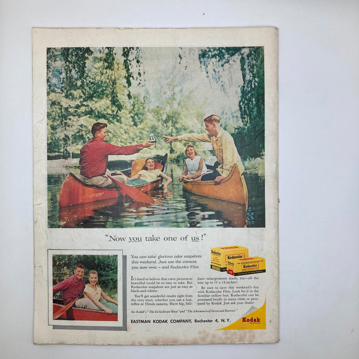 Back cover of the Saturday Evening Post Magazine, July 26, 1958, featuring a colorful Kodak advertisement with people in canoes, promoting summer fun with photography.