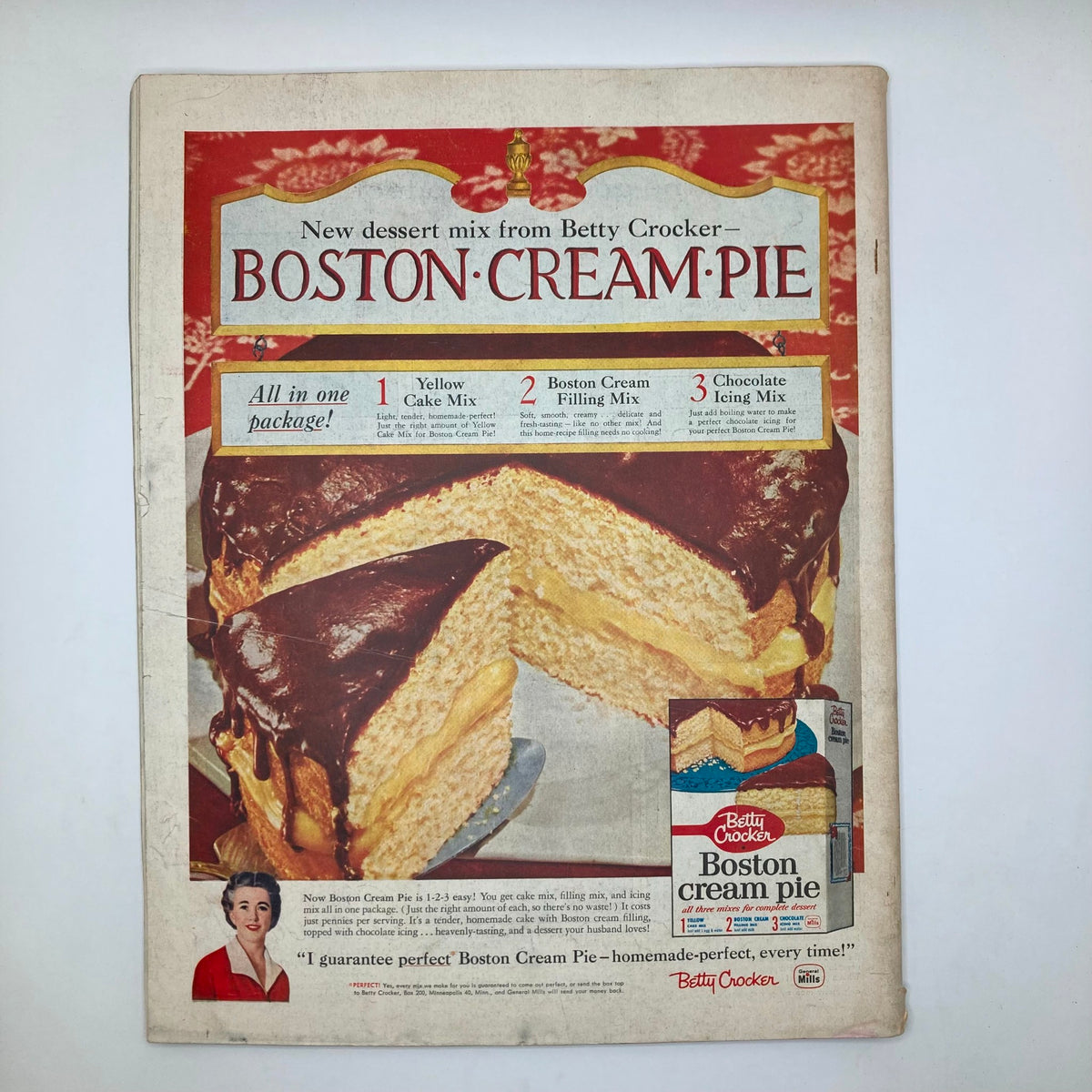 Advertisement page for Betty Crocker's Boston Cream Pie dessert mix in the Saturday Evening Post Magazine November 29, 1958, featuring a mouth-watering image of the cake and preparation instructions.