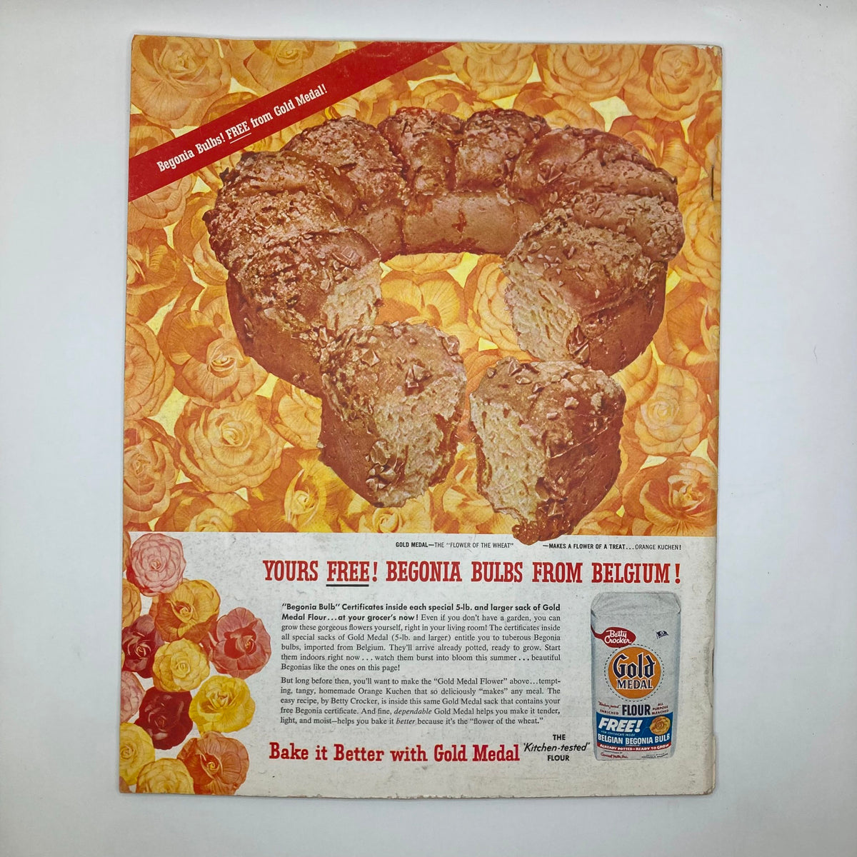 Back cover of Saturday Evening Post Magazine January 26 1957, displaying a colorful advertisement for Gold Medal Flour with a promotion for begonia bulbs.