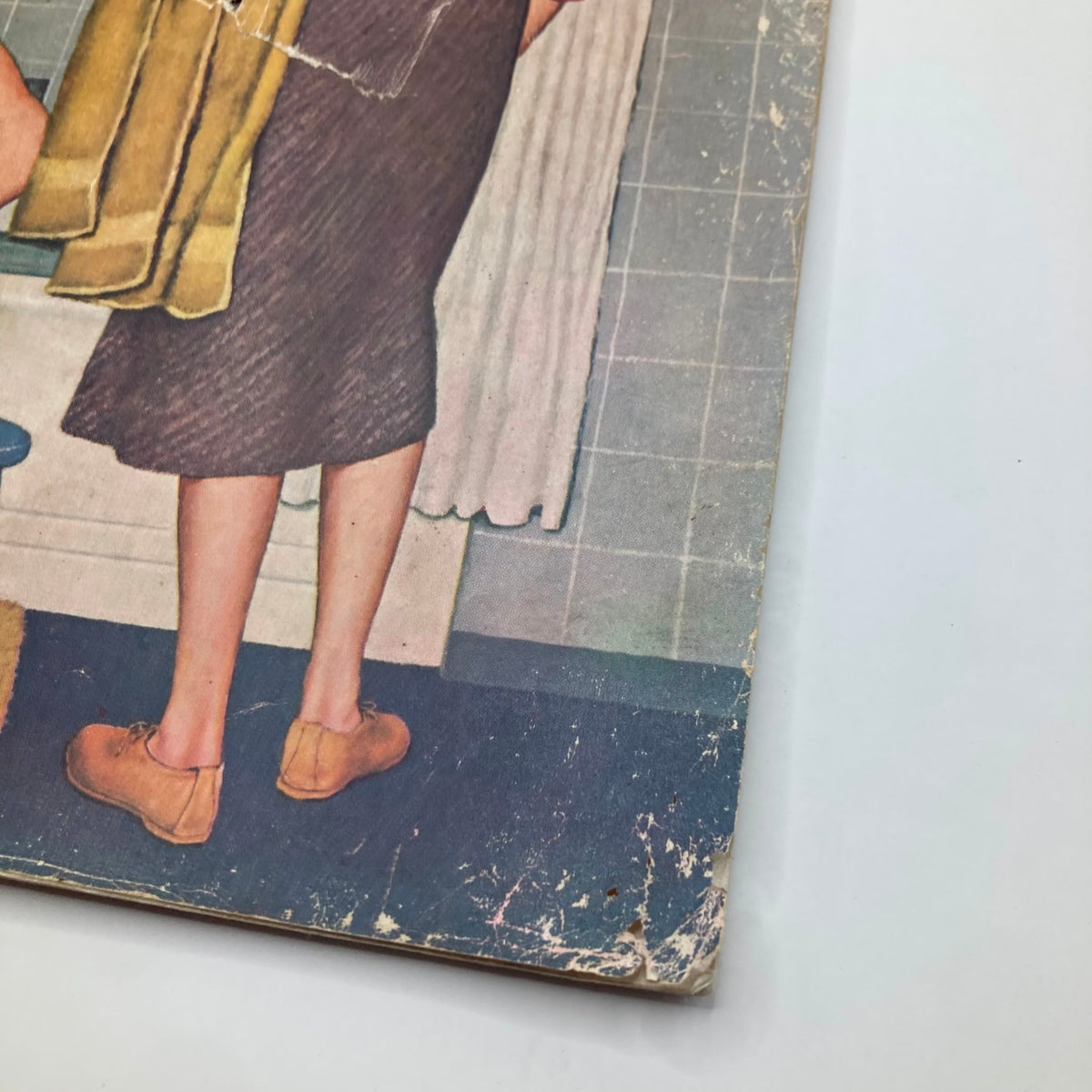 Close-up view of the cover of the Saturday Evening Post Magazine, November 29, 1958, illustrating a child with flippers preparing for a dive, with notable wear and creases, emphasizing its vintage character.