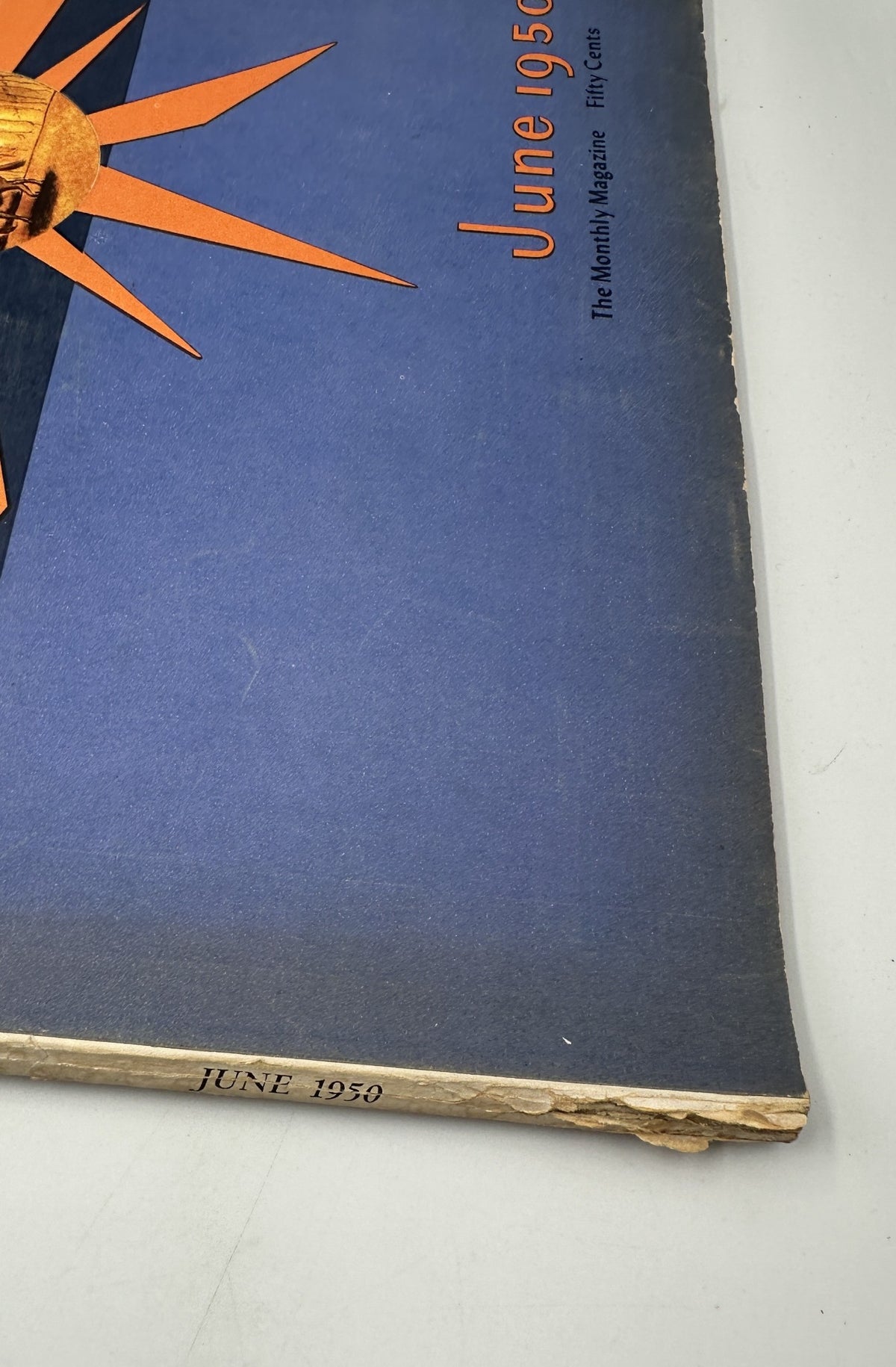 Close-up view of the spine of Flair Magazine June 1950, showing the publication date and highlighting its vintage aesthetic.