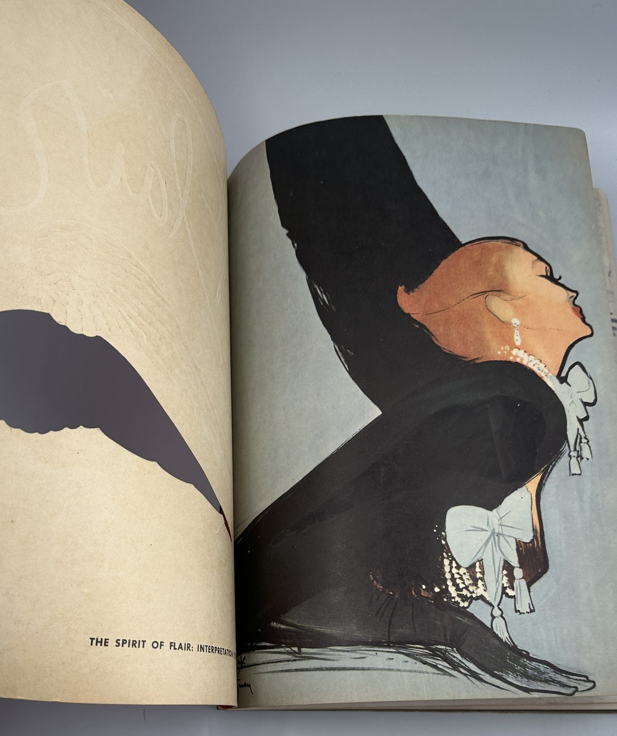 Interior page of Flair Magazine February 1950 showcasing an artistic illustration of a woman in elegant attire, reflecting the magazine's focus on fashion and style.