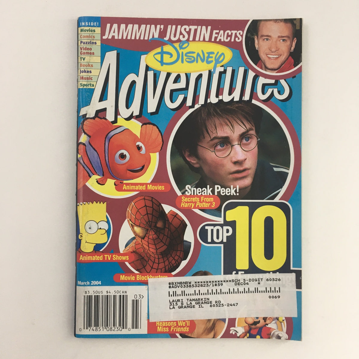 Cover of Disney Adventures Magazine March 2004 featuring Justin Timberlake and Daniel Radcliffe, highlighting animated movies and top 10 features.