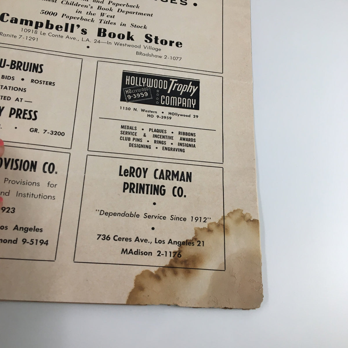 Back cover of the February 10, 1962 NCAA Basketball Stanford vs UCLA Official Program with wear marks, showcasing its history and authenticity.