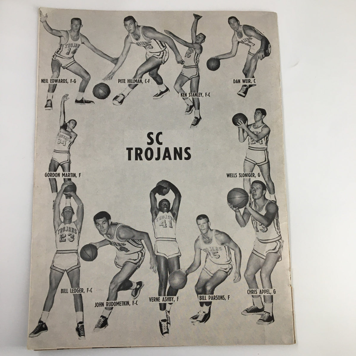 Back cover of the NCAA Basketball program from December 17, 1960, featuring various SC Trojans players in action poses, showcasing their athleticism.