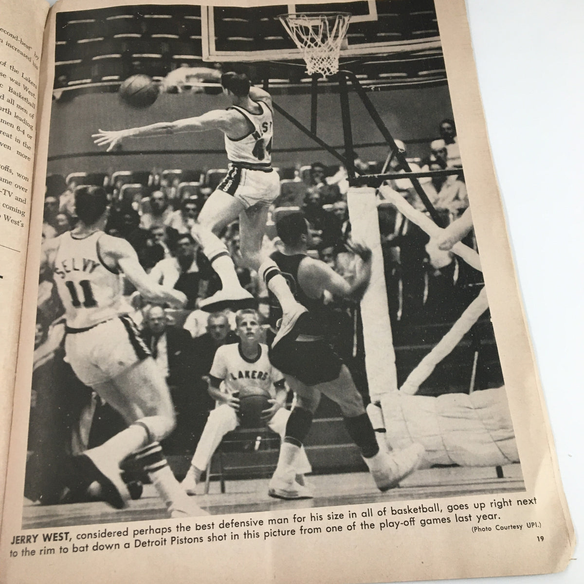 Image of Jerry West, considered the best defensive player, in action during a basketball game featured in the 1961-1962 Jim Loscutoff Rod Hundley Los Angeles Lakers Boston Game Program.