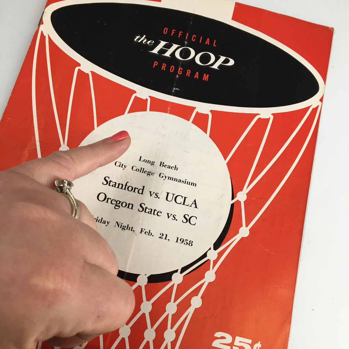 Cover of the February 21 1958 NCAA Basketball UCLA vs Stanford Official Program featuring a basketball hoop graphic.