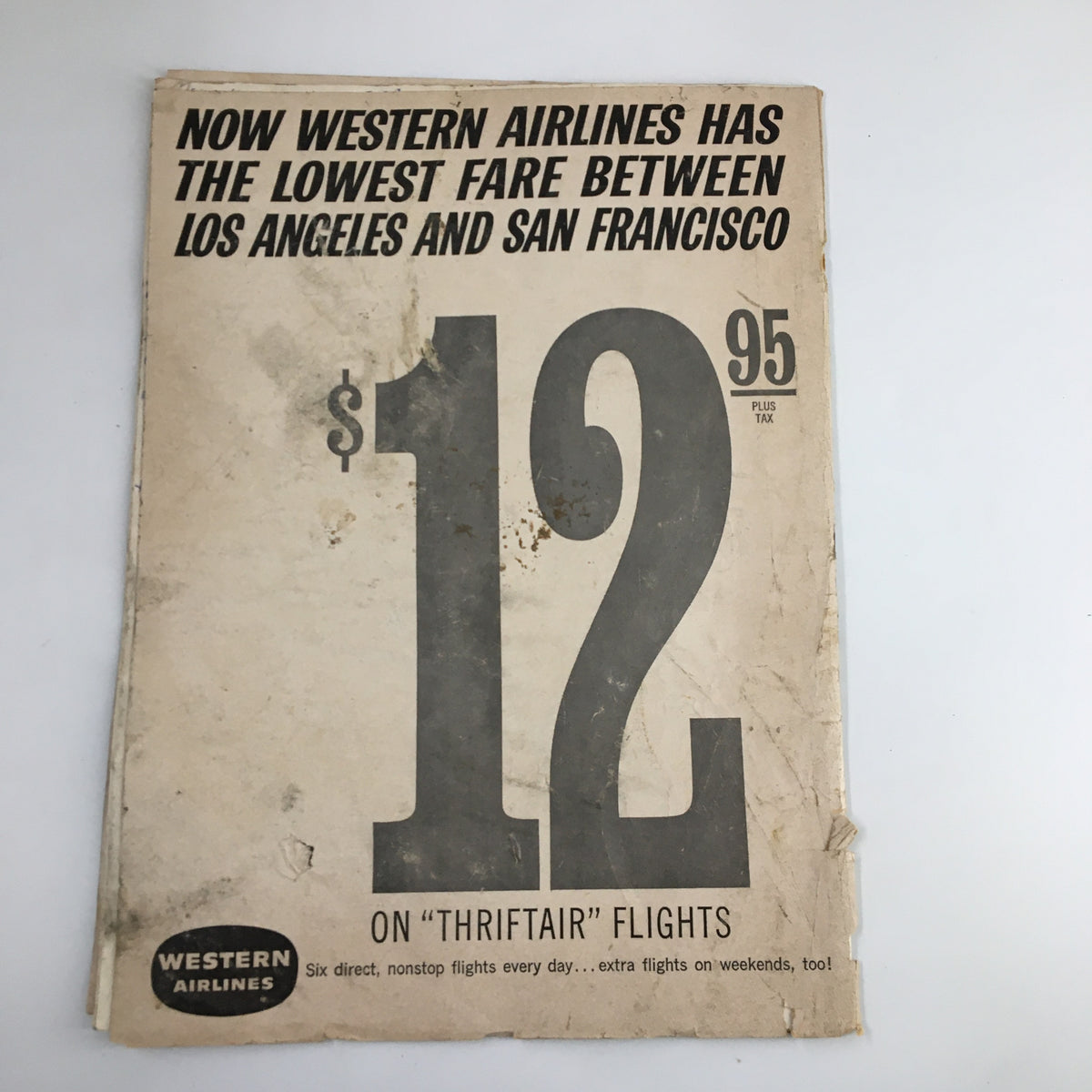 Cover page of the February 1, 1963 NCAA Basketball USC vs UCLA Official Program featuring a Western Airlines advertisement for low fares.