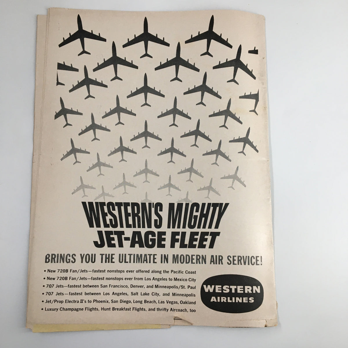 Western's Mighty Jet-Age Fleet advertisement showcasing various airplane models, featuring Western Airlines branding and text about their services, related to the November 30, 1962 NCAA Basketball UCLA vs Denver Official Program.