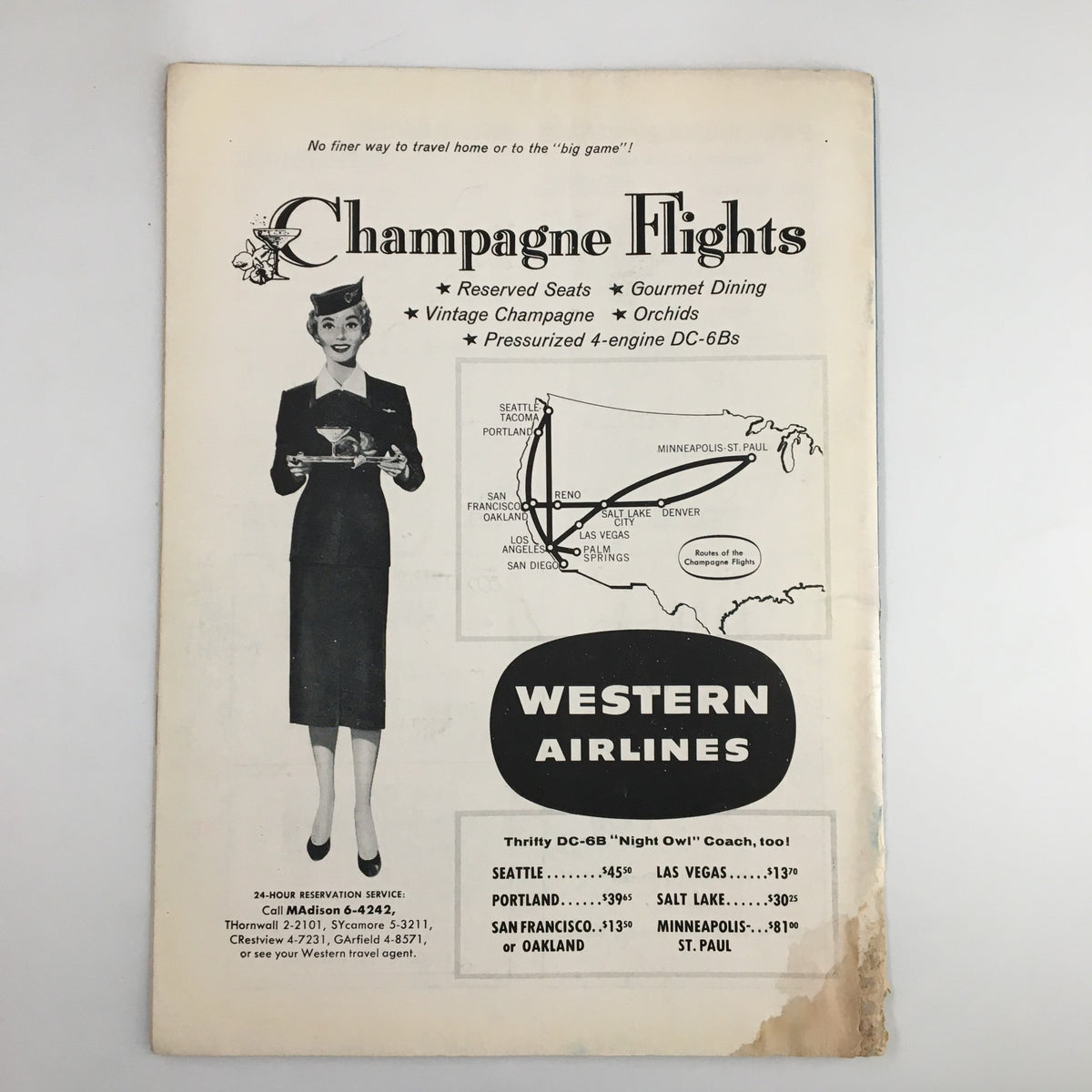 Back cover of the December 1, 1956 NCAA Basketball game program showing a vintage advertisement for Western Airlines with a woman in a formal outfit.