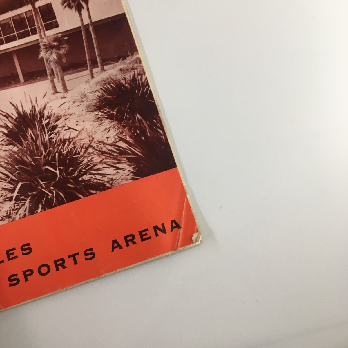 Close-up view of the cover from the December 26, 1963 NCAA UCLA vs Utah State Basketball Classic official program, displaying the event details and distinctive graphics of the Los Angeles Memorial Sports Arena.